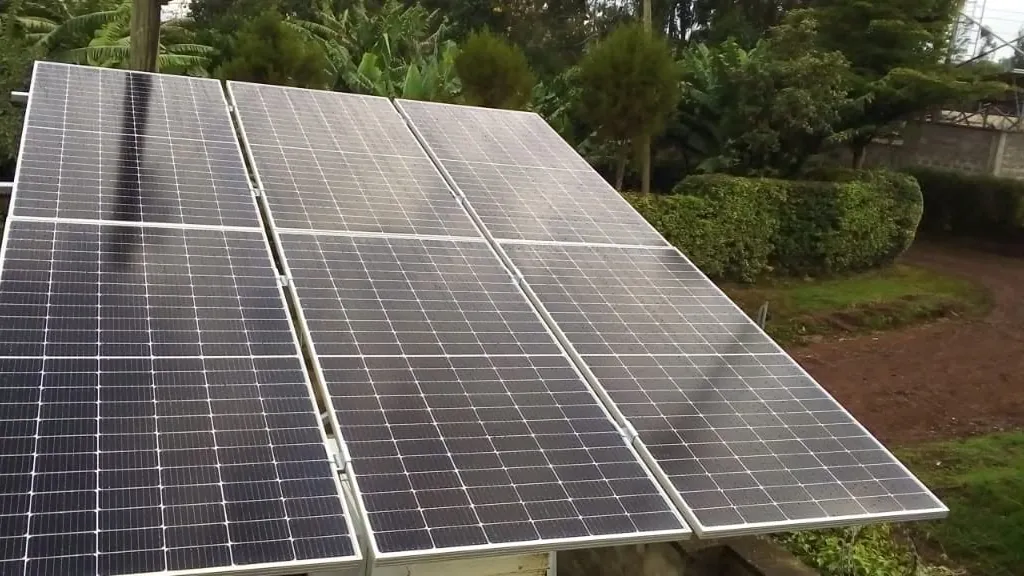 Ground-mounted solar panels installed on a compound