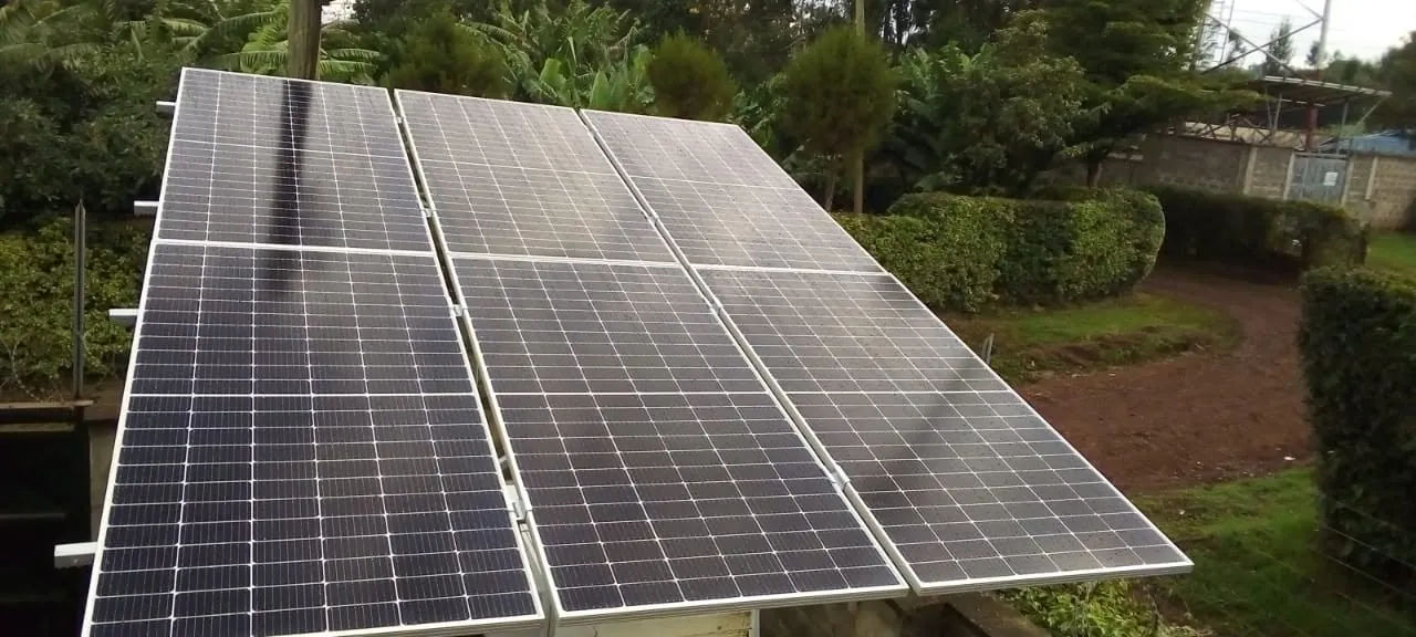 Ground-mounted panels: Ground-mount PV array on a compound.