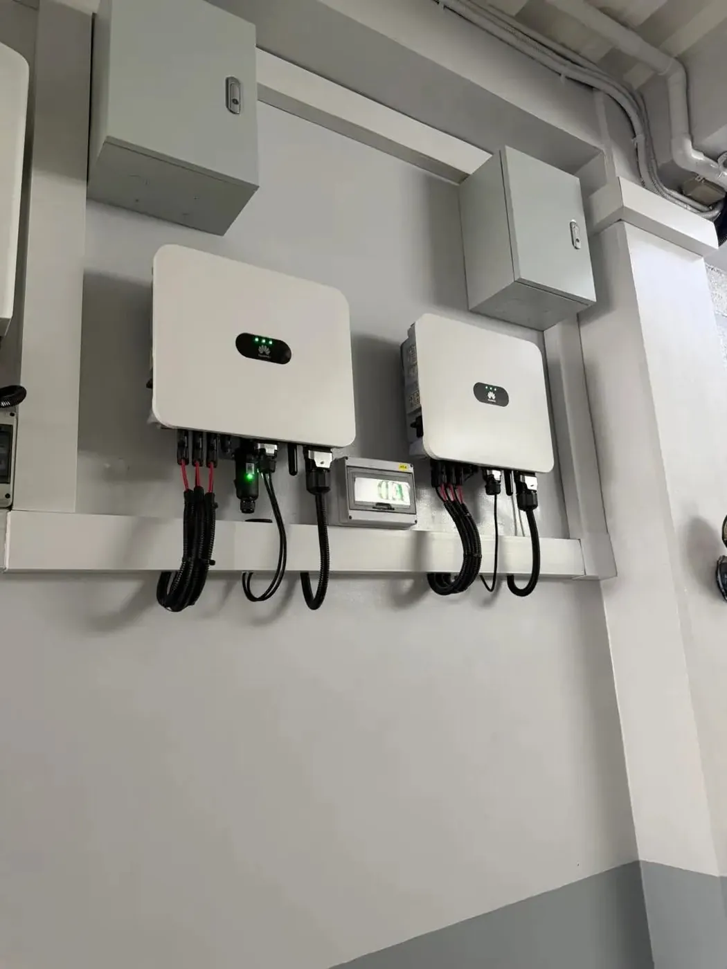Hybrid inverters: Wall-mounted inverters with tidy cable routing.