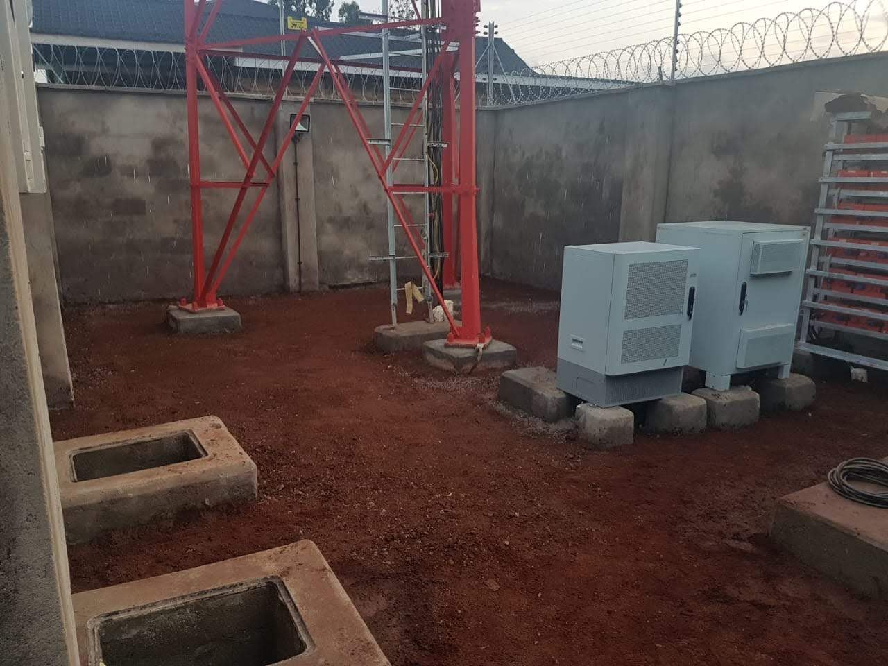 Tower and equipment compound supporting camera and lighting infrastructure